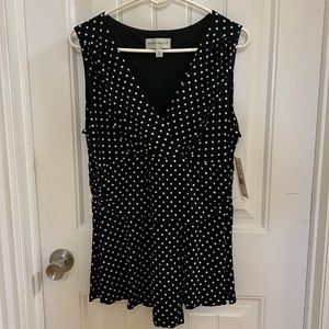 Sleeveless, black and white polka dot top.